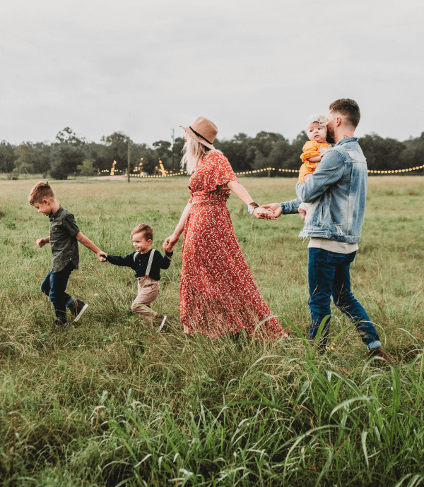 A family walking through a field